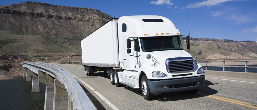 Truck Driving Down Highway